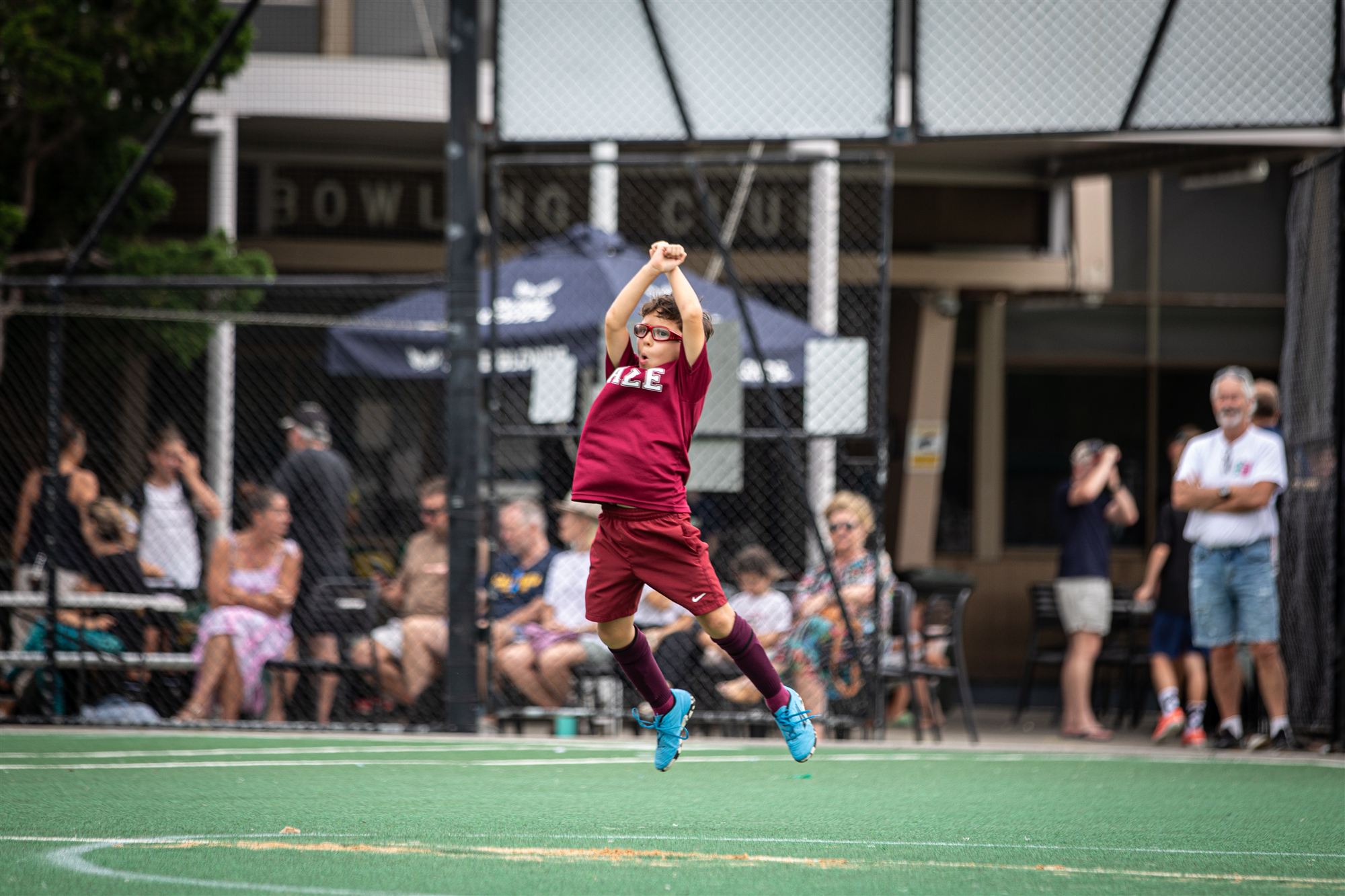 Player jumping in celebration, arms raised