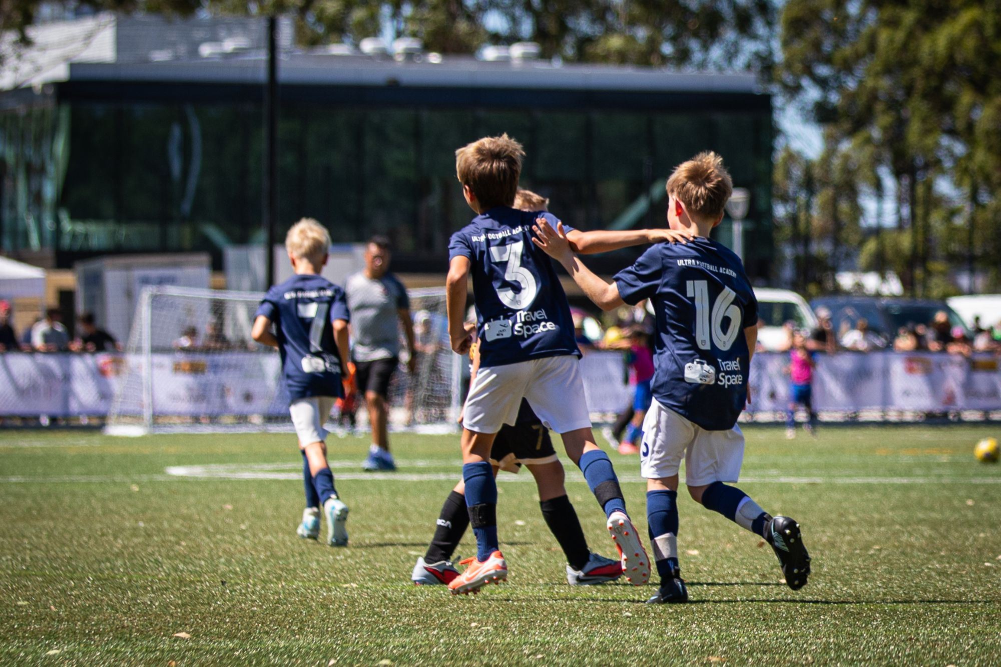 Teammates coming together for a high-five after a goal
