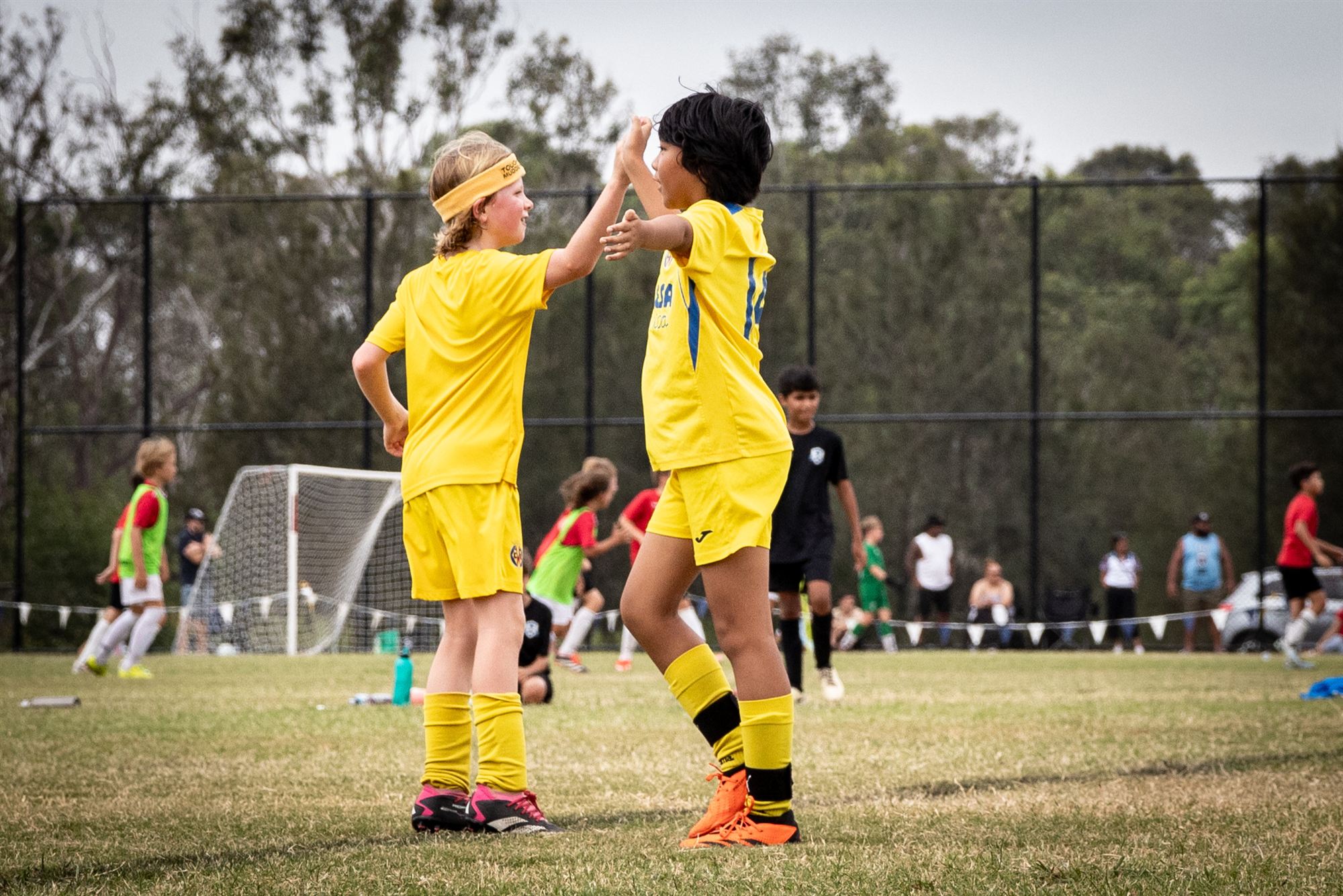Teammates high-fiving after the match